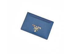 This cobalt blue Prada card holder is the perfect accessory to just slide in your pocket or bag. With its 2 card slots and one bill slot, you can have everything you need close by. This card case is not bulky so it can discretely carry your essentials. Made in Italy.    Brand: Prada   Model: 1MC208  Color: Blue/Bluette  Card Slots: 2 slots  Middle Slot Opening  Dimensions: 4 X .1 X 3" (LWH)  Made in Italy  Authenticity Cards and box included. Prada Card Holder, Blue Prada, Prada Model, Card Case Wallet, Small Cards, Slide In, Blue Leather, Card Case, Cobalt Blue