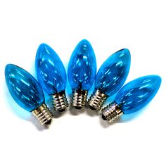 four blue christmas lights on white background