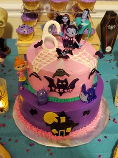 there is a cake decorated with cartoon characters on it