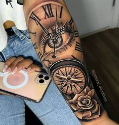 a woman's arm with a clock and roses tattoo on her left arm, next to an iphone