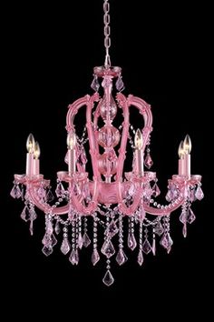 a pink chandelier hanging from the ceiling with crystal drops on it's sides