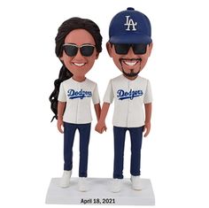 two bobble heads with dodgers baseball uniforms on them