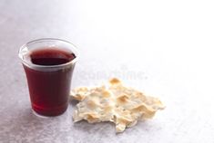 a cup of tea next to crackers on a white surface royalty images and stock photos