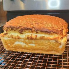 a sandwich sitting on top of a metal rack