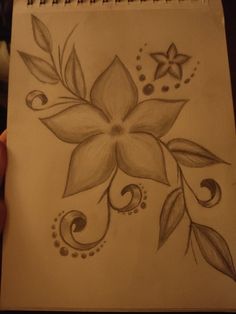 a drawing of a flower with leaves and swirls on it's back side