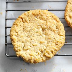 two cookies sitting on top of a cooling rack