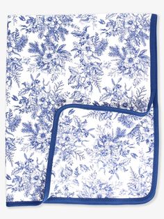 two blue and white bedspreads with floral print on the bottom one has a blue border