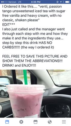 a pink drink sitting on top of a table