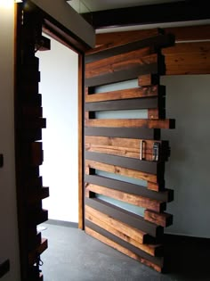 the door is made out of wooden planks