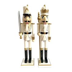 Crisp and precise in their shining white and gold bejeweled uniforms, these nutcrackers will give an elegant boost to your holiday display. The king nutcracker carries a royal staff, while the guard nutcracker wields a silver sword. Beautifully handcrafted from wood and hand painted, this set of two 24" White & Gold King and Guard Nutcracker are sure to provide many seasons of pleasure. Santa's Workshop | Santa's Workshop 2 Piece King & Guard Nutcracker Set 24.0 H x 6.0 W x 5.0 D in black / brow Royal Staff, King Nutcracker, Nutcracker Decor, Indoor Holiday Decor, Jeweled Christmas, Santa's Workshop, Holiday Display, The Guard, Fall Halloween Decor