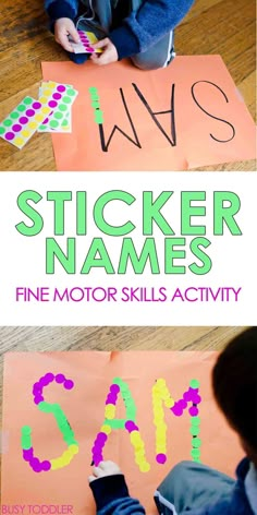 a child is sitting on the floor and making a sticker name sign with their hands