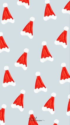 red and white santa hats on a pink background