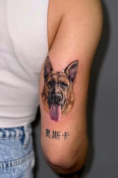 a man with a tattoo on his arm has a dog's face and chinese characters