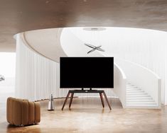 a flat screen tv sitting on top of a wooden stand in front of a white wall