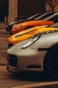 a row of sports cars parked next to each other