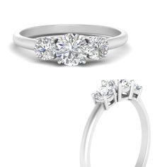 three stone engagement ring with four diamonds on the side and an oval diamond in the middle