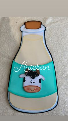 an image of a cow in a bottle with name on it