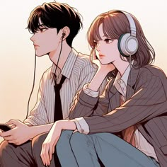 two people sitting next to each other with headphones on