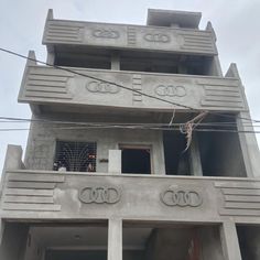 an apartment building that has audi emblems on it