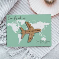 a wooden card with the map of the world on it