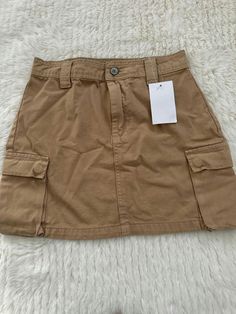 Brandy Melville Brown cargo skirt One size  BNWT Brown Cargo Skirt, Cargo Skirt, Brandy Melville, Festival Season, Short Outfits, Brandy, Korean Fashion, Art Collection, Bathing Beauties