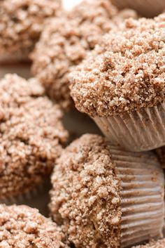 there are several chocolate muffins stacked on top of each other with crumbs all over them