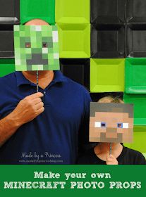 a man standing next to a boy with a paper mask on his face and a minecraft head