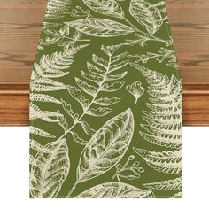 an ironing board with leaves on it