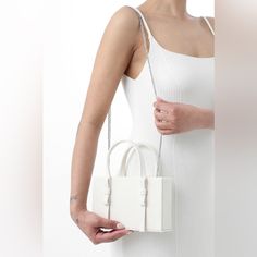 Brand New Condition. Never Been Used. Mini Leather Tote Bag From Kara Featuring Ivory White, Top Zip Fastening, Two Flat Top Handles, Chain-Link Shoulder Strap, Main Compartment And Main Compartment. White Crossbody Evening Bag, White Satchel Evening Bag With Detachable Strap, White Crossbody Evening Bag With Detachable Handle, White Crossbody Evening Bag For Shopping, White Satchel Evening Bag For Party, Trendy White Satchel Evening Bag, Elegant White Satchel For Party, White Top Handle Box Bag For Party, White Satchel Box Bag For Party