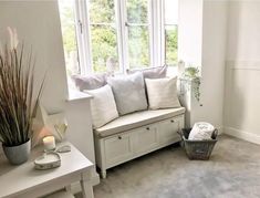 a living room filled with furniture and a window