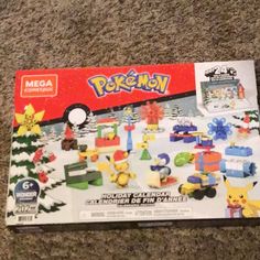 the box is full of pokemon toys on the floor