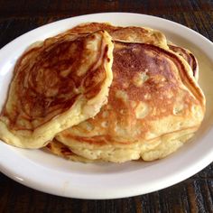 two pancakes stacked on top of each other on a white plate