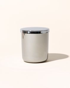 a silver container sitting on top of a white surface