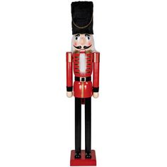 a wooden nutcracker with a black hat and red coat