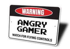 an angry gamer sign with the words watch for flying controls in red and black letters