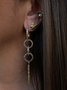 As seen in Harper's Bazaar. Available and ready to ship in solid 18k yellow gold in limited quantities. The Facette Earcuff slips on and wraps itself lovingly around the middle of your ear, resting on the pad of your earlobe, no piercing required. This jewel has a beautiful organic geometry as each facet was hand carved by Delphine, then cast in 18k recycled gold and polished to a high shine. Wear one, or stack them up for a bolder look. Designed and crafted in NYC. For other gold options and ma Ancient Alchemy, Organic Geometry, Alchemy Symbols, Medium Hoop Earrings, Charm Holder, Charm Rings, Harper's Bazaar, Recycled Gold, Gold Beads