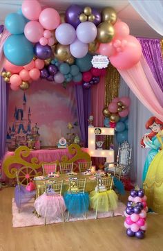 a room filled with lots of balloons and tables