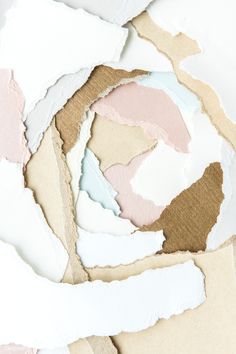 torn paper with pastel colors on it and brown, pink, white, and blue