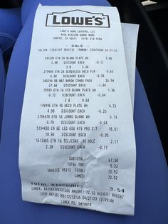 a receipt sitting on top of a blue seat