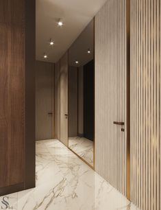 an open door leading into a bathroom with marble floors and walls, along with wooden slats on the walls