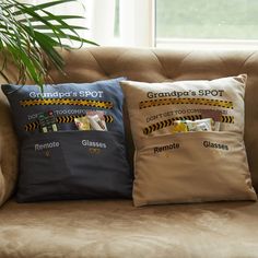 three pillows on a couch with the names grandpa's spot and grandpa's spot