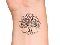 a small tree tattoo on the wrist