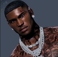 a man with tattoos and piercings on his face wearing a necklace that has chains attached to it