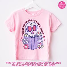 a pink shirt with a skull reading a book