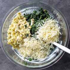 pasta, spinach and cheese in a glass bowl