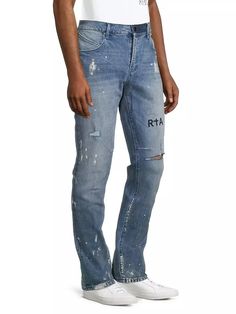 RTA's Clayton five-pocket jeans feature a vintage-like splatter effect, distressing at the knee, and an embroidered logo on the front. Designed with comfortable stretch, this style fastens with a button fly..Five-pocket style.Button fly.98% cotton/2% spandex.Machine wash.Imported.SIZE & FIT.Inseam: about 33'.Model measurements: 6’1' tall, 30.5' waist.Model is wearing a US size 32.For basic alterations and hemming,.book an appointment.online at your local Saks Fifth Avenue location..RTA's Clayton five-pocket jeans feature a vintage-like splatter effect, distressing at the knee, and an embroidered logo on the front. Designed with comfortable stretch, this style fastens with a button fly.Five-pocket styleButton fly98% cotton/2% spandexMachine washImportedSIZE & FITInseam: about 33'Model measu Clothing Pants, Book An Appointment, Pants Jeans, Pocket Jeans, Model Measurements, Distressed Jeans, Jeans Pants, Saks Fifth, Saks Fifth Avenue