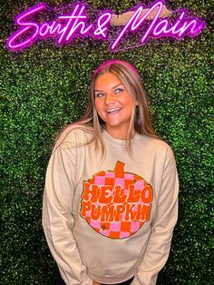 Welcome the season of pumpkin spice with the Hello Pumpkin Chenille Sweatshirt! This comfy crewneck sweater is crafted from cozy chenille fabric and decorated with bright orange and pink. It’s perfect for fall, and everybody needs one! You’ll be the cutest one this season! So what are you waiting for? Get yours now! Unisex sizing and fit SPECIAL CARE - WASHING INSTRUCTIONS: Hand washing and air drying are always best for these items. Wash on delicate, cold, and inside out. Always air dry to prev Pink Graphic Print Sweater For Fall, Orange Crew Neck Sweatshirt For Fall, Orange Cotton Sweatshirt For Fall, Trendy Orange Sweatshirt For Fall, Pink Crew Neck Sweatshirt For Fall, Fall Cotton Orange Sweater, Pink Graphic Print Fall Sweater, Halloween Chenille Sweatshirt, Chenille Letters Sweatshirt