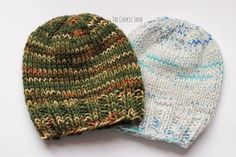 two knitted hats sitting next to each other