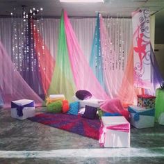 the room is decorated with colorful curtains and decorations for a birthday or other special event