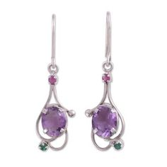 Totaling over six carats a two glistening ovals of purple amethyst are accompanied by petite ruby and emerald stones in this alluring pair of dangle earrings from India. Alok Jain presents the earrings which are crafted of sterling silver by local artisans. Oval Amethyst Earrings With Gemstone Accents, Elegant Gemstones With Gemstone Accents For May Birthstone, Elegant Gemstones With May Birthstone Accents, Elegant May Birthstone Gemstones With Accents, Purple Oval Earrings With Gemstone Accents, Green Amethyst Oval Jewelry, Green Oval Amethyst Jewelry, Elegant Purple Birthstone Gemstones, Moonstone Pendant Necklace